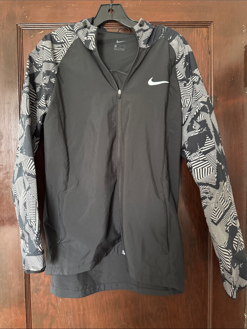 Nike Women’s Black Hooded Zip Jacket with Reflective Patterned Sleeves